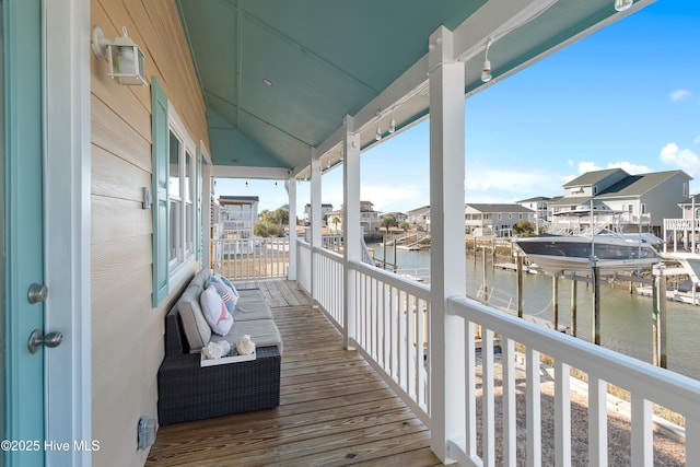 balcony featuring a water view