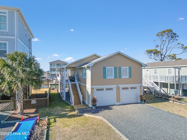 view of front of house featuring a front lawn and a garage