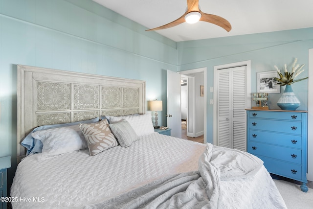 bedroom with a closet, ceiling fan, and lofted ceiling