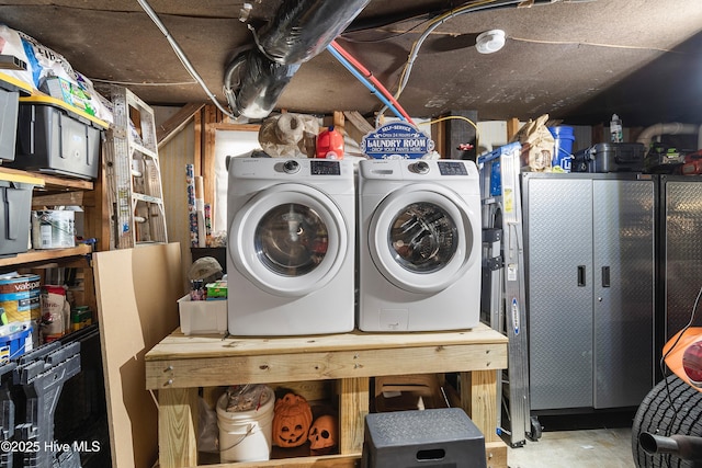 washroom with independent washer and dryer