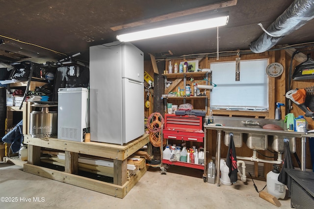 basement with white refrigerator