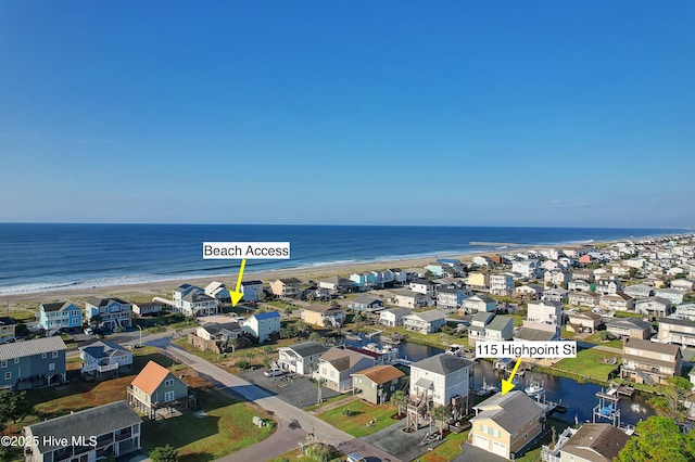 bird's eye view featuring a beach view and a water view