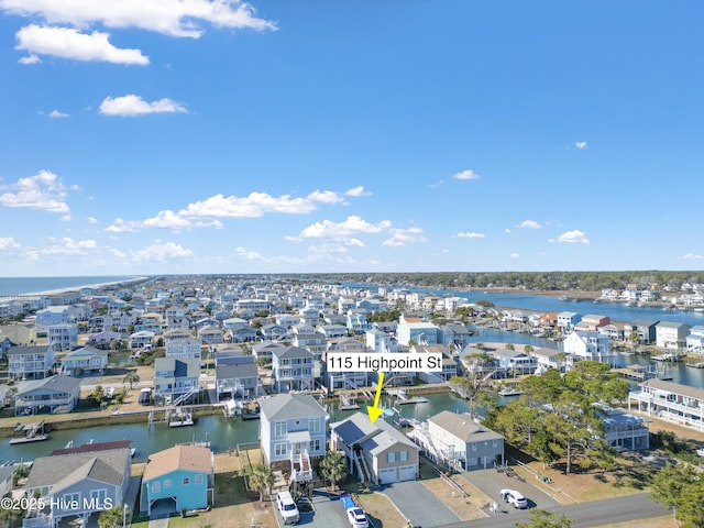 drone / aerial view with a water view