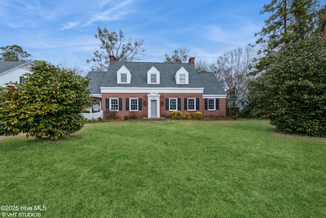 cape cod home with a front yard