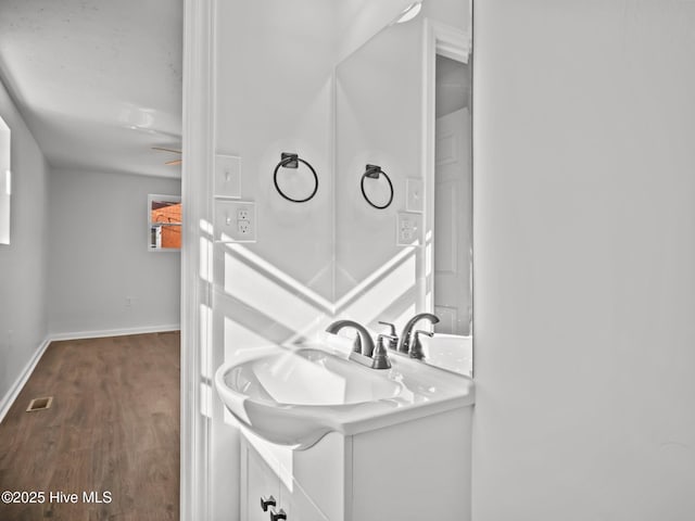 bathroom featuring vanity and hardwood / wood-style floors