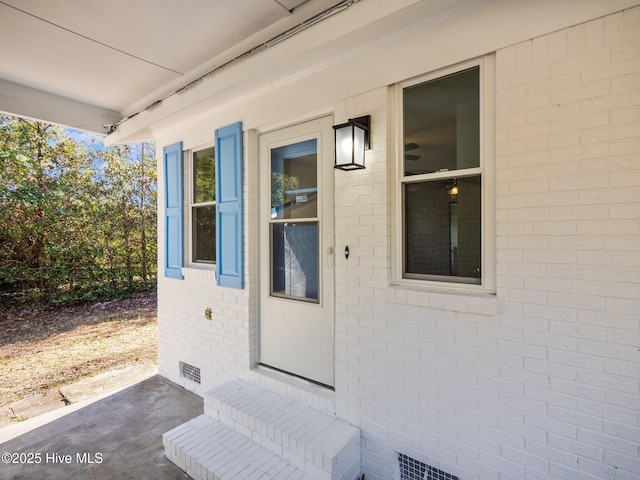 doorway to property featuring a patio