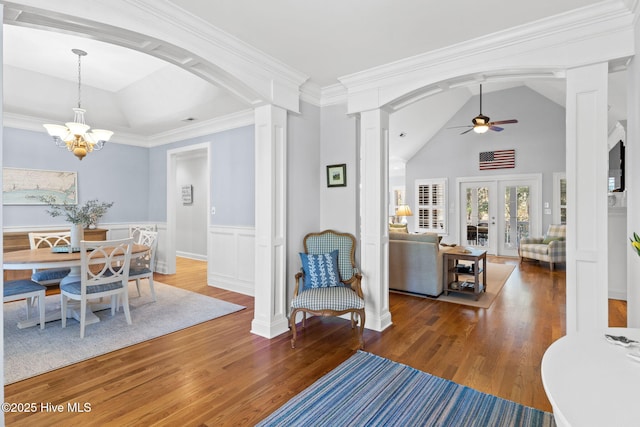 552 Glenmora Ave SW, Supply, NC 28462 - dining area featuring decorative columns, ceiling fan, wood finished floors, vaulted ceiling, and a chandelier