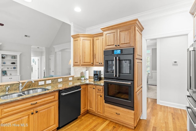 kitchen featuring sink, light stone counters, double wall oven, black dishwasher, and kitchen peninsula