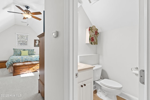 552 Glenmora Ave SW, Supply, NC 28462 - half bath featuring lofted ceiling, a ceiling fan, toilet, vanity, and baseboards