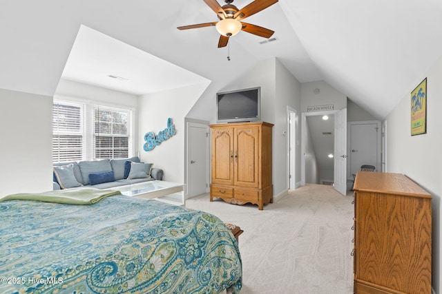 carpeted bedroom with vaulted ceiling and ceiling fan