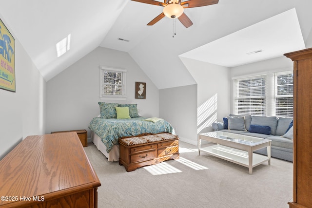 carpeted bedroom with vaulted ceiling and ceiling fan