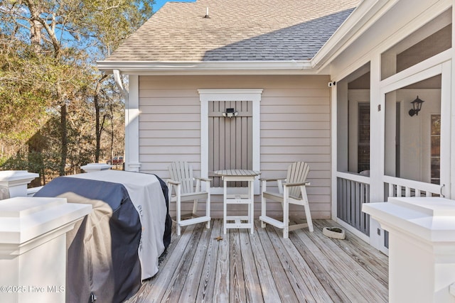 wooden deck with grilling area