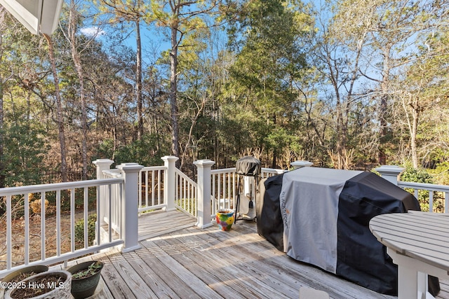 wooden terrace featuring grilling area