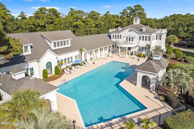 552 Glenmora Ave SW, Supply, NC 28462 - back of house featuring a patio, a balcony, a community pool, a pergola, and fence