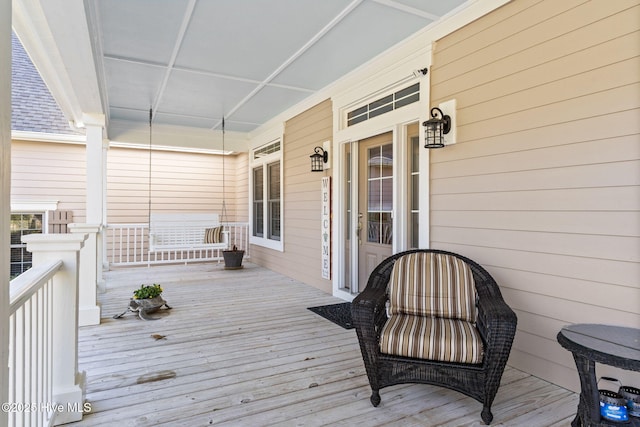 wooden deck featuring covered porch