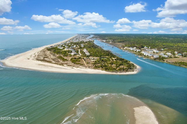 bird's eye view with a water view and a beach view