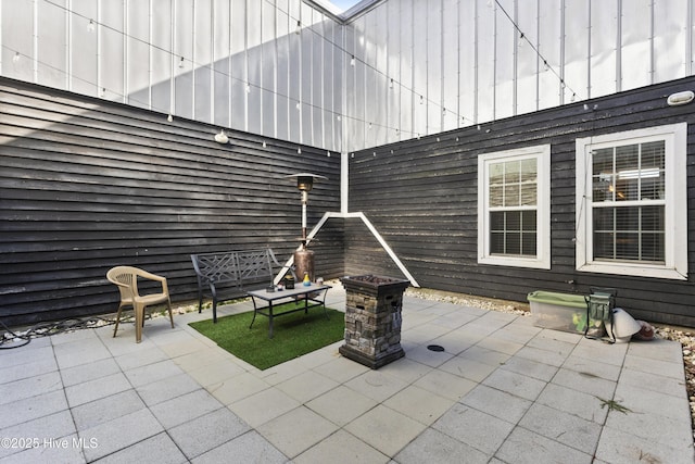 view of patio featuring an outdoor fire pit