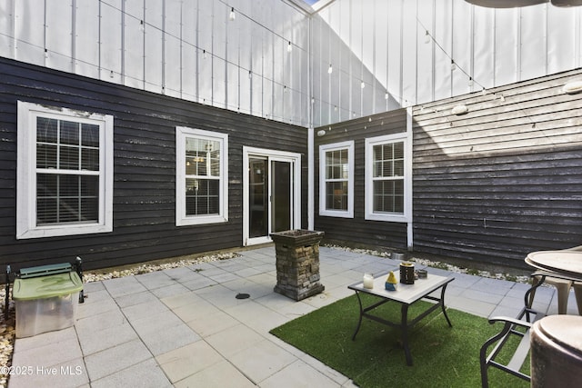 view of patio with a fire pit