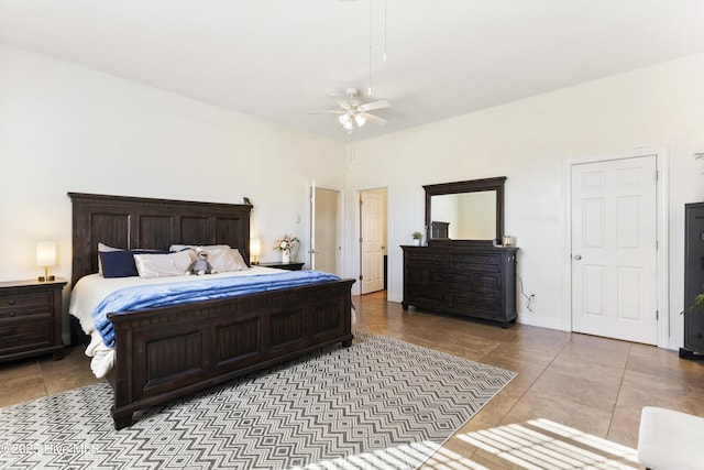 tiled bedroom featuring ceiling fan