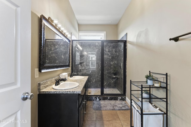 bathroom featuring an enclosed shower, vanity, and tile patterned floors