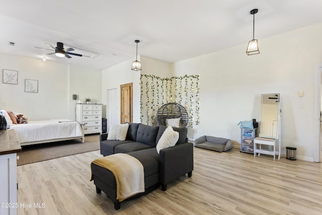 bedroom featuring light hardwood / wood-style floors and ceiling fan