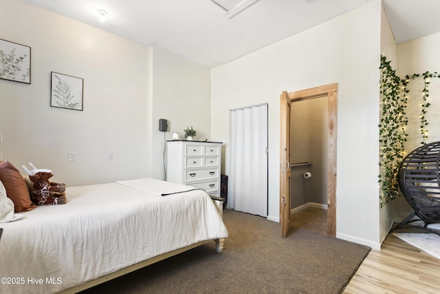 bedroom with hardwood / wood-style floors