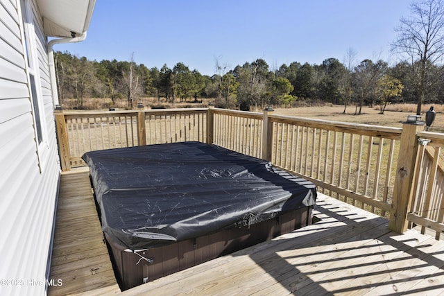 wooden terrace featuring a covered hot tub