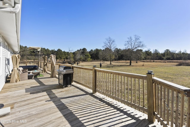 wooden deck with grilling area and a yard