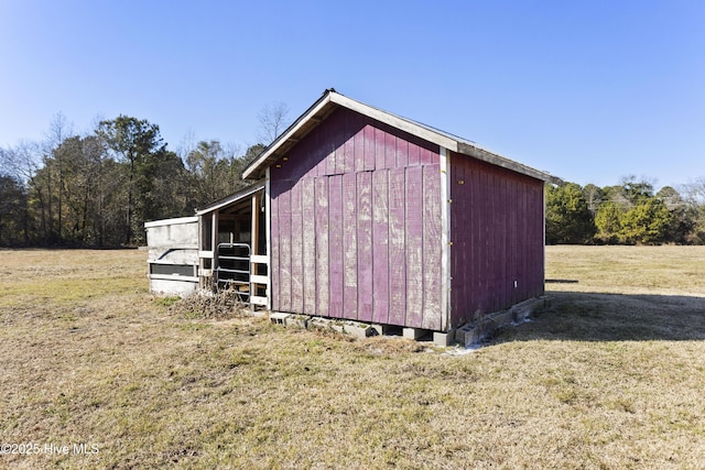 view of outdoor structure with a lawn