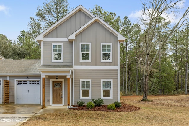 view of front of property with a front lawn and a garage