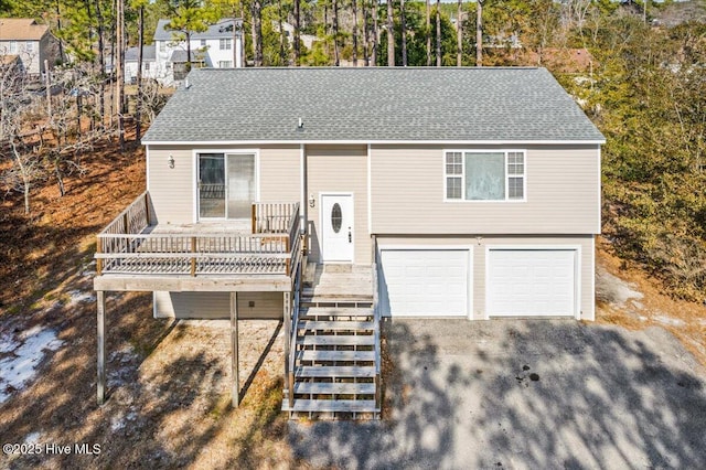 view of front facade with a garage and a porch