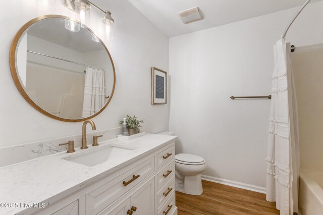 bedroom with ceiling fan, crown molding, and wood-type flooring