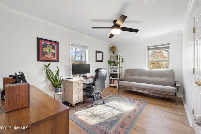 office with ornamental molding, ceiling fan, and light wood-type flooring