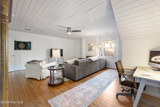 office space with ceiling fan, crown molding, and wood-type flooring