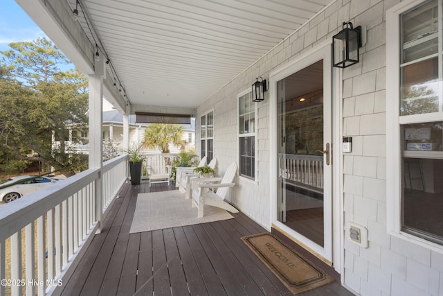 wooden terrace featuring a porch