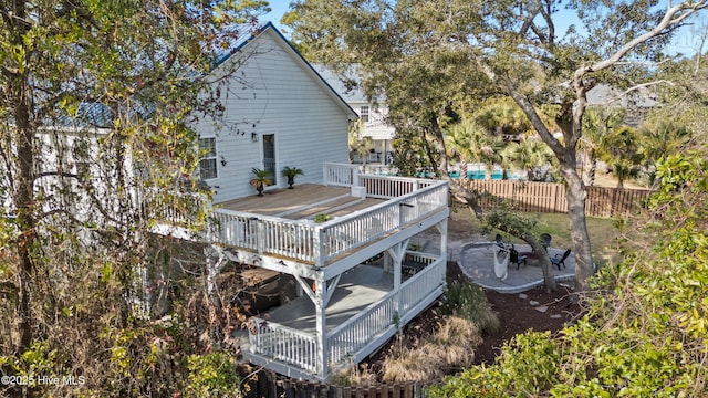 wooden terrace featuring a patio