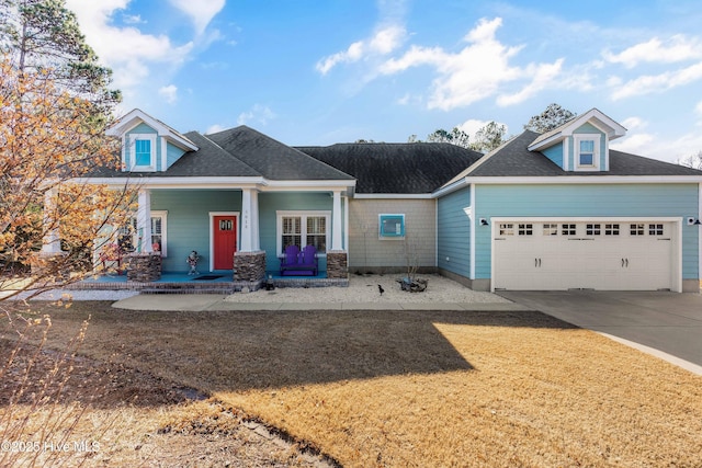 view of front of house featuring a garage and a porch