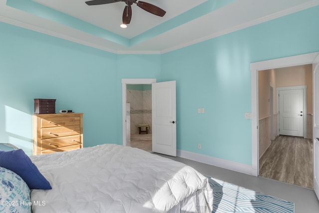 bedroom with ceiling fan, crown molding, and a raised ceiling