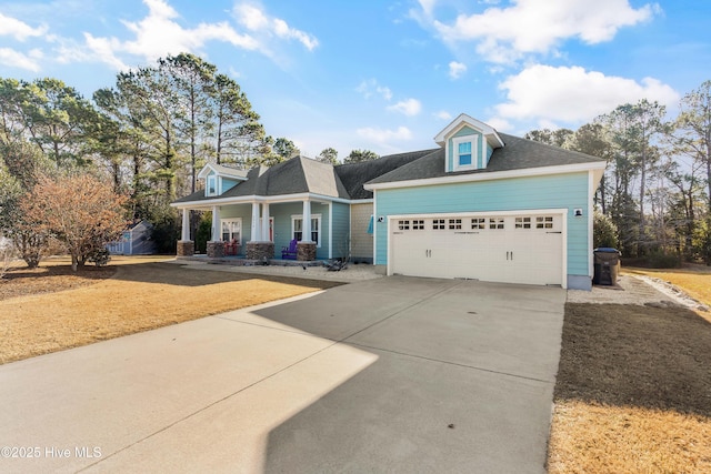 view of front of home featuring a garage and a porch