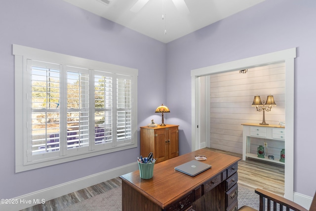 office space with light wood-type flooring and ceiling fan