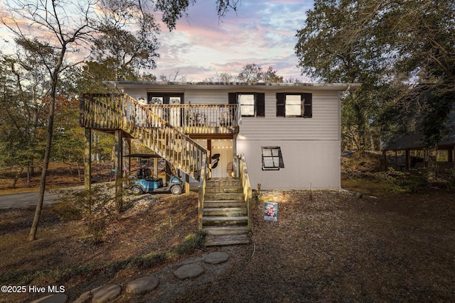 front of property featuring a wooden deck