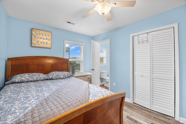 bedroom featuring light wood-type flooring, a closet, and ceiling fan