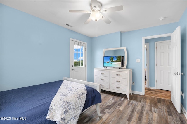 bedroom featuring dark hardwood / wood-style flooring and ceiling fan