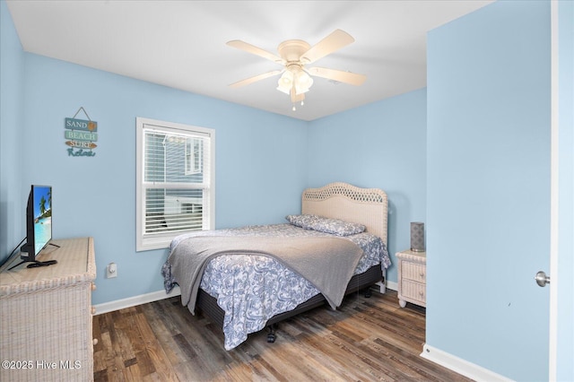 bedroom with ceiling fan and dark wood-type flooring