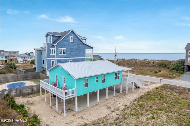 rear view of property featuring a water view