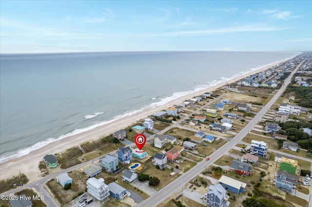 bird's eye view featuring a view of the beach and a water view