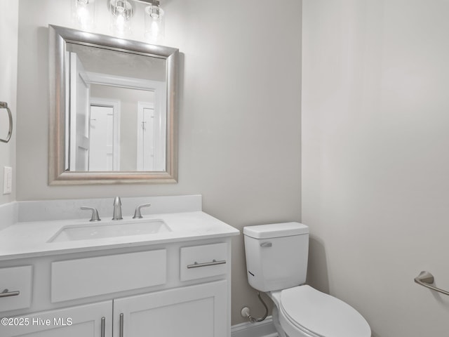 half bath with vanity and toilet