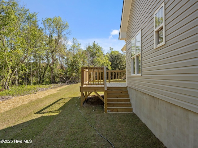 view of yard with stairway and a deck