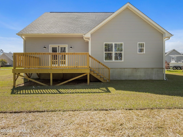 back of property with stairs, roof with shingles, a yard, and a deck