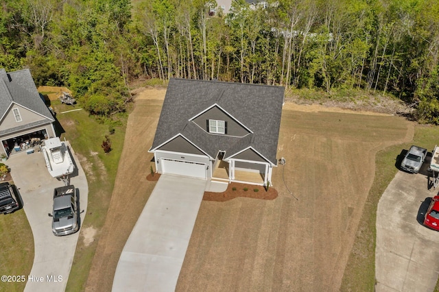 aerial view featuring a wooded view